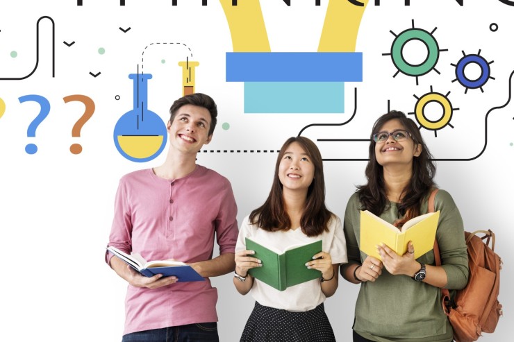 A teenage boy and 2 teenage girls hold books and look up to the word thinking above them