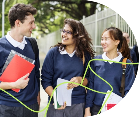 Students walking outside talking and smiling