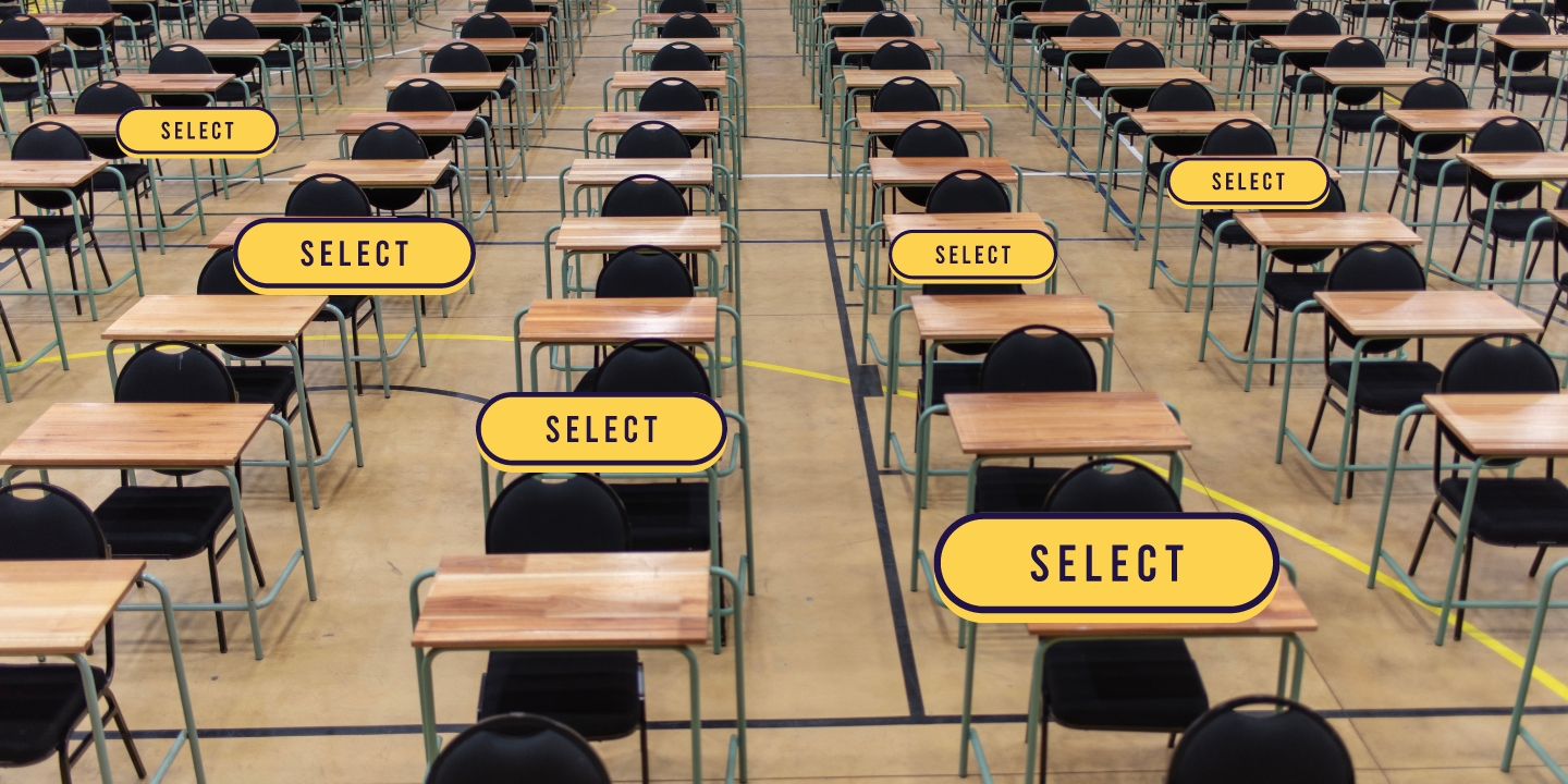 An exam hall with empty chairs and tables and yellow 'select' buttons on a number of them.