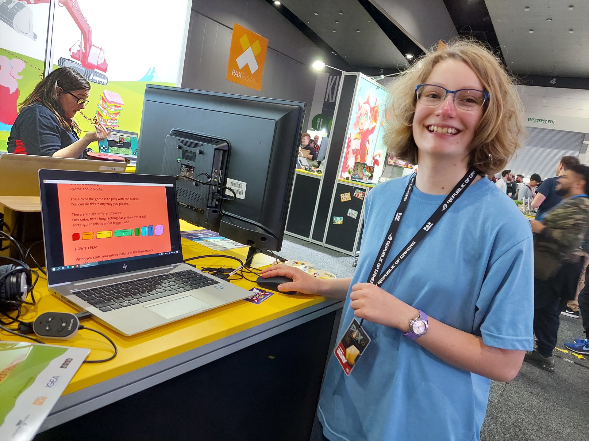 Dee stands beside her game at the PAX Australia Festival
