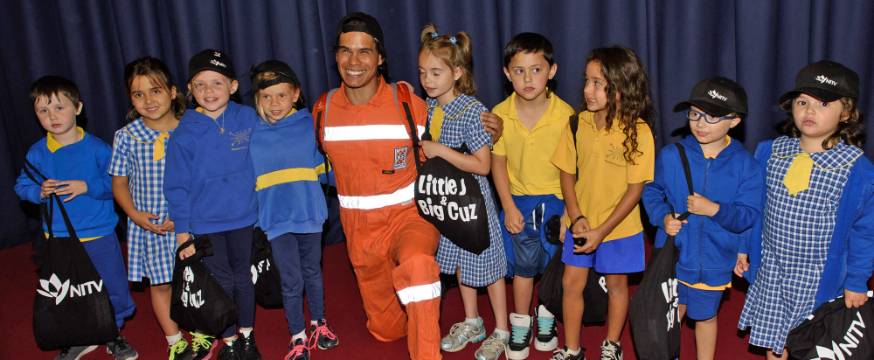Students from Theodore Primary School with 'Little J & Big Cuz' voice actor Mark Coles Smith dressed as his character, Uncle Mick.