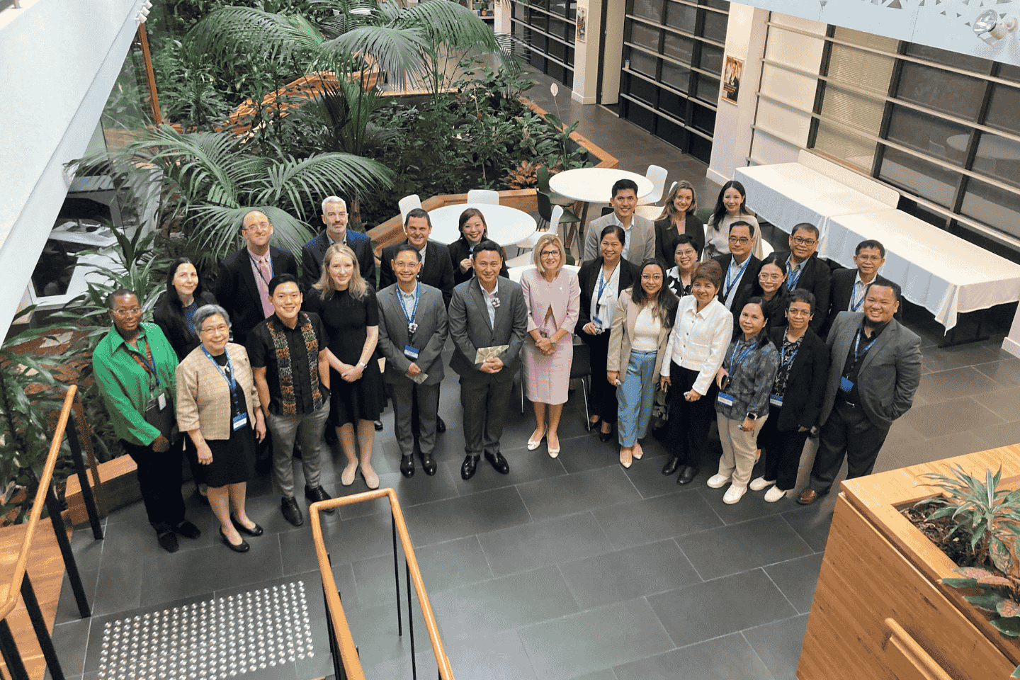 ACER staff and high-level delegation from the Philippines pose for a photograph in the ACER foyer.